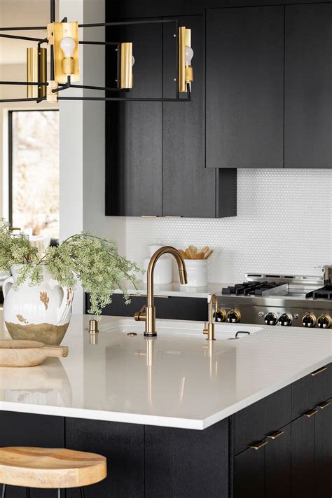 black granite white cabinets gold pulls stainless steel appliances|black and gold kitchen cabinets.